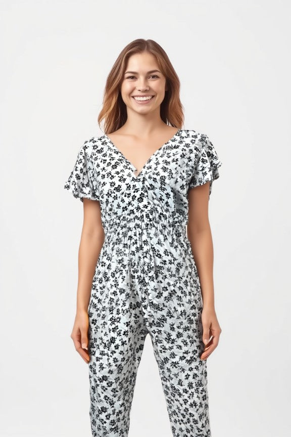 Women's floral print jumpsuit in white with short sleeves and shirred waist